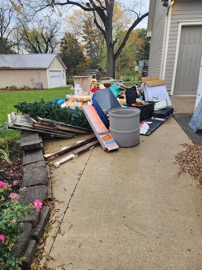 Dumpster being loaded with debris for Estate Cleanout Dumpster Rental in Loomis